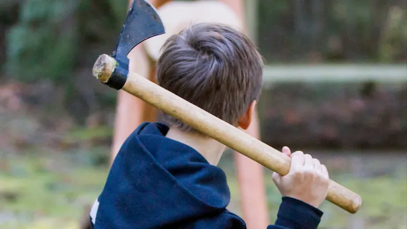 Axe throwing at safe supervised throwing lanes