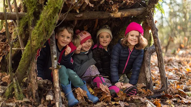 Campers exploring the winter forest together